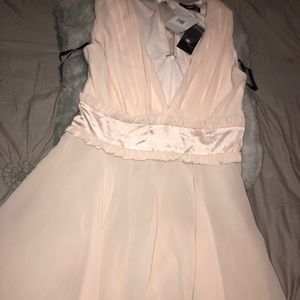 a beautiful nude dress. Never worn before